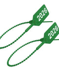 Bulletproof 2026 Year Dated Fire Extinguisher Tamper Seals Green Pull Tight Security Wire Ties close-up view showing two tags.