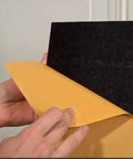 Peel And Stick Door Kick Plate Wall Scuff Guard Scratch Resistant Self Adhesive Backing being unpeeled for installation.