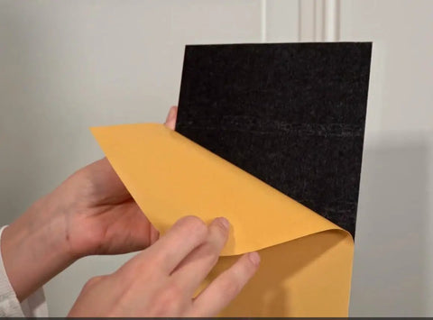 Peel And Stick Door Kick Plate Wall Scuff Guard Scratch Resistant Self Adhesive Backing being unpeeled for installation.