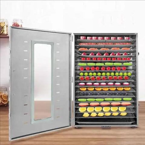 Heavy Duty Stainless Steel Electric Food Dehydrator Pulls A Hefty Multi Tray Load For Drying Fresh Fruits And Veggies showing stacked racks of dried fruit.