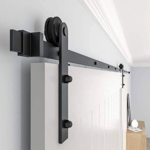 Black Straight Design Sliding Barn Door Hardware Kit for Single Wood Door, track system with roller installed on wall.