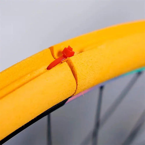Close-up of Air-Liner Tire Insert For Tubeless-Ready Bike Tires No Flat Protection And Rim Guard in a wheel, showing foam material.
