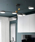 Sleek Modern 6 Head Sputnik Chandelier With Smooth 360 Degree Rotating Gold Pendant Light Top Notch Ceiling Fixture For Dining Room Bedroom Kitchen Setup Featuring Vintage Edison Socket in stylish living room.