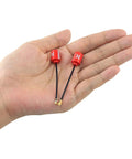 Lollipop FPV 5.8G RHCP UFL Antenna for RC Drones, 65mm, red, held in hand, showing compact size and UFL connectors