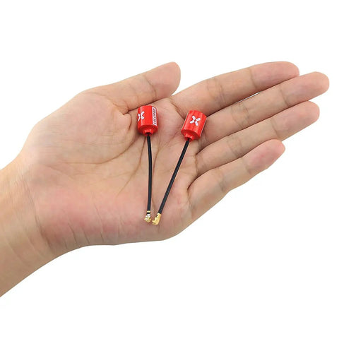 Lollipop FPV 5.8G RHCP UFL Antenna for RC Drones, 65mm, red, held in hand, showing compact size and UFL connectors