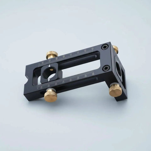 Premium Adjustable Hole Positioning Jig With Stainless Steel Sleeves For Accurate Doweling And Cabinet Assembly, featuring aluminum housing and brass knobs.