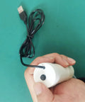 Hassle Free Grab And Go Portable Usb Oil Extractor Pump With Suction Syringe Flexible Hose held in hand for easy use.