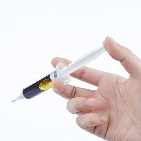 Hand holding Black UV Soldering Paste Flux 10cc For PCB And BGA Circuit Boards Protection Pro Grade Curable Solder Mask Welding Flux Oil