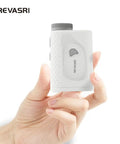 Hand holding Golf Range Finder With Magnetic Mount Slope Compensation Flag Lock Vibration Measures In Yards Feet And Meters