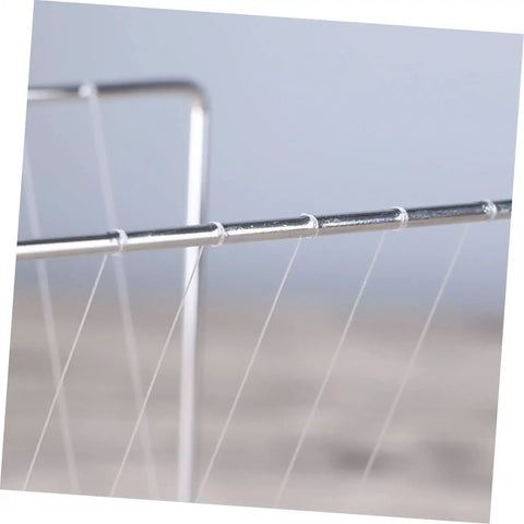 Close-up of metal bars and strings on Newton's Cradle Pendulum Desk Toy Square Desktop Decor For Home Or Office Stress Relief Gadget