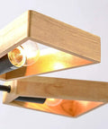 Modern Metal Pendant Chandelier With Five E27 Sockets And Compatible Slim Led Fixtures Sleek Black Finish Top Tier Build For Dining Room Or Living Area Gonna Turn Heads close-up of wooden frame and bulb