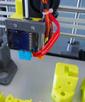 Built Tough Hypercube Evolution 3D Printer Metal Frame Kit With 300X300X300MM Square Build Volume And Complete Black Aluminum Extrusion Hardware Bundle, showing the extruder and printed parts.
