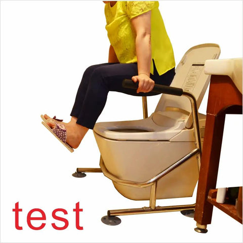 User demonstrating Heavy Duty Toilet Safety Rails With Adjustable Support Leg For Seniors, built on toilet, stainless steel frame.