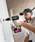 High Performance 18V Cordless Drill Driver With Brushless Motor And Dual 2Ah Lithium Ion Batteries Using One Half Inch Keyless Chuck For Heavy Duty Projects And Weekend Buildouts Built Like A Tank For True Pro Power in use drilling into drywall.