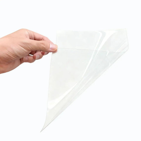 Hand holding Pro Grade A4 PET Sublimation Film 8.3 By 11.7 Inches 3D Heat Transfer Film Matte Clear PreTreat Sheets