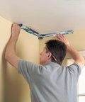 No Sweat Heavy Duty Digital Angle Finder Miter Calculator Protractor Level in use to measure a ceiling corner.