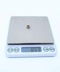 10 Pack MR84RS MR84-2RS Color Ball Bearings for Hobby RC Cars and Trucks on digital scale showing weight 0.59