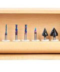 Kickass Eight Piece Router Bit Set With One Quarter Inch Shanks And Bulletproof Ceramic Coating for CNC cuts in a wooden box.