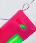 Close-up of pink and green needle threader from 3Pcs Automatic Needle Threader Set For Hand Sewing Easy No Fuss Threading Device For Small Eye Needles Ideal For DIY Embroidery Cross Stitch Craft Projects Elderly Friendly Tailors And Hobbyists