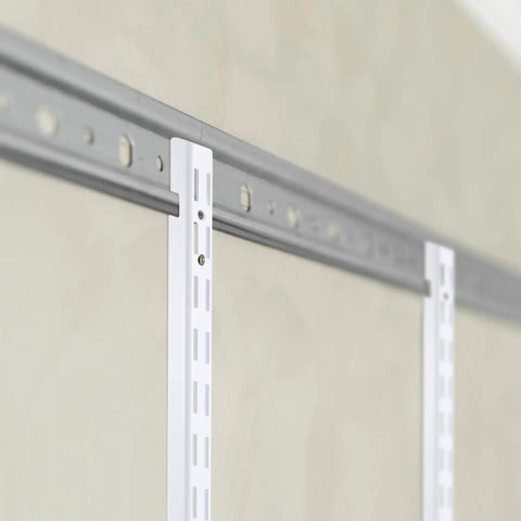 Close-up of a white 12-inch dual track upright wall shelf with notched bracket rail for Four Piece Set Of Twelve Inch Dual Track Upright Wall Shelves With Notched Bracket Rail And Heavy Duty Adjustable Brackets For Quick Rock Solid Wall Mount Storage Setup.