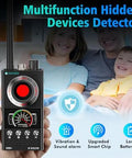Hidden Camera Detector And Bug Detector With Magnetic Tracker And Wireless Signal Finder in hand, family in background