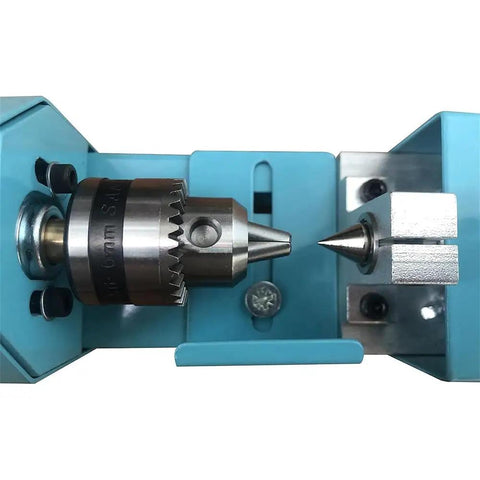 Close-up of the adjustable chuck on Beast Mini Wood Lathe Milling Machine Set with metallic grinding accessories.