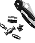 Heavy Duty Titanium Handle Screws For Para3 And Knives CNC Precision Shank Bolts In Glossy Blue Finish next to various screws and knife.