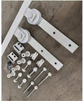 Heavy Duty Double Bypass Sliding Barn Door Hardware Kit With Low Profile Flat Track System components in white, showcasing brackets and screws.