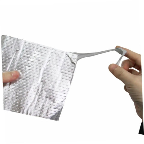 Heavy Duty Repair Tape With Super Sticky Adhesive For Leak Stopping On Flexible Pipes Roofs And Outdoor Gear Weatherproof Sealant Tape For Quick DIY Fixes And Rugged Weatherproof Patches, showcasing a stretch of the adhesive strip in hand.