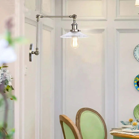Top Tier Adjustable Swing Arm Wall Sconce With Hand Blown Glass Shade And Hella Bright Up Down Ambient Glow E27 Bulb Suits Bedroom Bedside And Study Reading In Cool Green Bronze mounted next to a dining table.