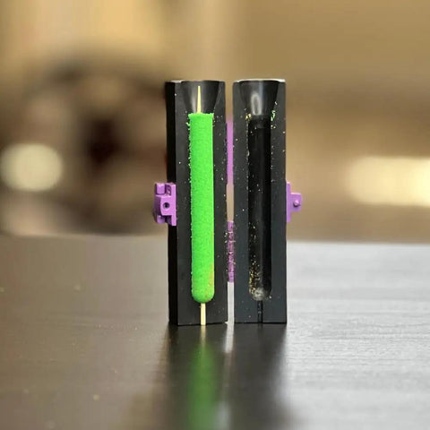 Mini Cannagar Mold And Cigar Roller Kit 1-2g Press with green cannagar in mold, black plastic with purple clips, on table