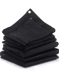 Stack of Heavy Duty 10x10 Shade Mesh Tarp With 80 Percent Shade Flat Black Polyethylene Netting, showing reinforced grommets.