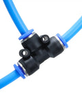 Close-up of 100 Ft 6mm ID 4mm OD Polyurethane Air Hose Ultra Flexible Pneumatic Tubing Blue connected with black fitting