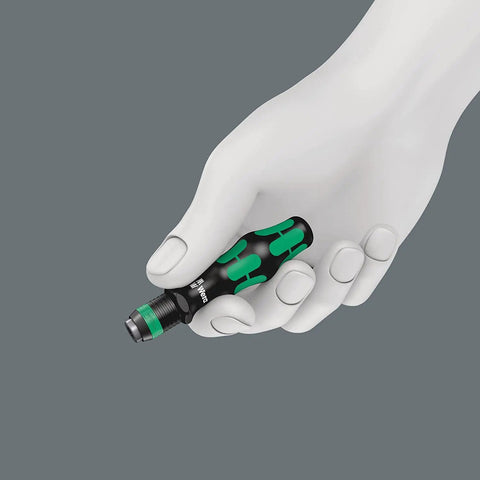 Hand holding Compact 52 Piece Metric Bit Set with Textile Pouch Rapidaptor Quick Bit Change in focus, showing black and green handle.