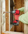 User operating Badass 18V 1/2-Inch Compact Cordless Drill Driver Bit Socket Adapter against wooden wall.