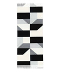 Black And White Piano Grid Winter Scarf Crafted From Plush Faux Cashmere With Extended Fringe Edges, displaying geometric pattern.