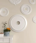 Ceiling Medallion For Canopies Up To 4 3 Eighth Inch, Outside Diameter 24 1 Eighth Inch, Inside Diameter 4 3 Eighth Inch displayed on wall