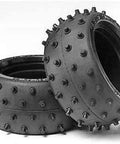 Buggy Tire Spike Studs 38mm Wide Two Pack for DT02 Chassis shown with durable rubber and all-terrain spikes