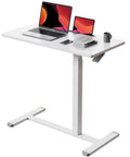 Mobile Standing Desk With Pneumatic Height Adjustment, Rolling Laptop Desk On Wheels, Height From 25.9 To 42.1 Inches, Overbed Bedside Table For Couch, Home Office, Portable White shown with laptop and tablet on white surface.