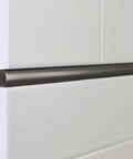 Side view of Soho Listel Low Pencil Tile Trim One Half Inch By 12 Inch Brushed Nickel Decorative Edge on white tile surface.