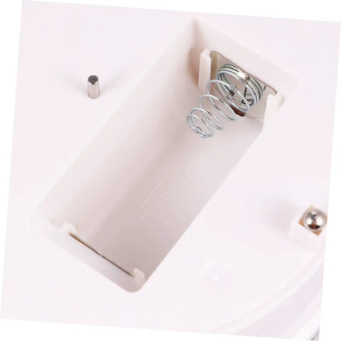 MiniKEYA Electric Rotating Display Stand USB Powered Turntable battery compartment with spring and metal contact.