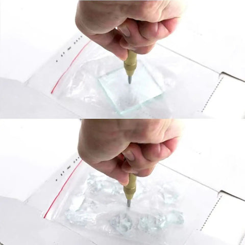 Demonstration of Five Piece Automatic Center Punch Kit Spring Loaded Adjustable Impact on glass, showing a hand applying pressure.