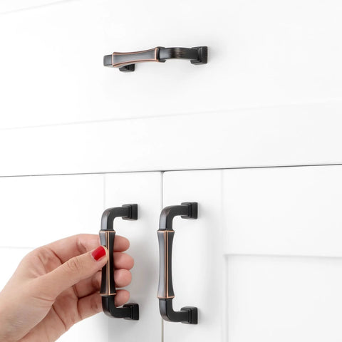 Hand installing 10 Pack 3 Inch Oil Rubbed Bronze Cabinet Pulls With Bronze Brushed Finish For Kitchen Cabinets And Drawers Durable Solid Metal