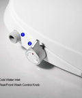 Close-up of non electric bidet toilet seat with self cleaning retractable nozzle, showing water inlet and control knob for elongated white toilets.
