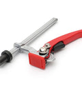 Hold Down Clamp With Quick Acting Ratchet for Woodworking Benches and Desktop Clips, red handle, alloy steel build, side view.
