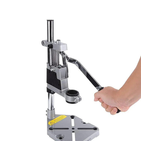 Adjustable Desktop Drill Stand With Universal Bench Clamp And Workbench Support shown in aluminum with a hand adjusting depth lever