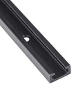 Close-up of a black anodized aluminum T-track, part of a 4 Piece 48 Inch Aluminum T Track Set For Woodworking Jigs And Fixtures With Screws.