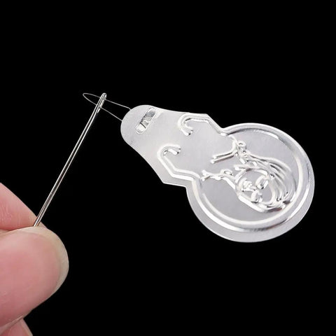 Close-up of gourd-shaped retractable threader from 40Pcs Aluminum Needle Threader Set, Handy Must Have Household Sewing Accessories For Quick Threading Through Needle Holes.