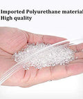Clear polyurethane tubing held in a hand with small translucent plastic pellets