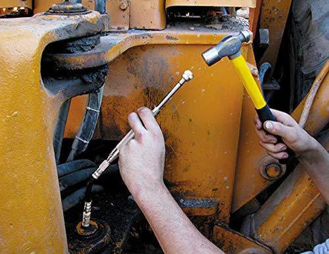 Grease Joint Rejuvenator Kit being used on yellow construction equipment with metal fittings
